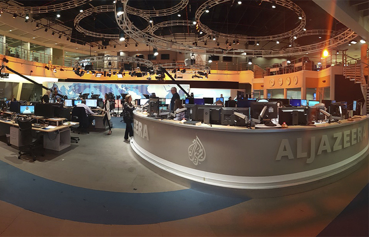 Al-Jazeera staff at the broadcaster's Doha headquarters in June 2017. Qatar's neighbors have demanded the country close the station as part of negotiations in the current political crisis. (AP/Malak Harb)