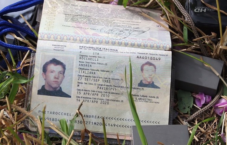 Andrea Rocchelli's passport is photographed on May 25, 2014, the day after his death. (AFP)