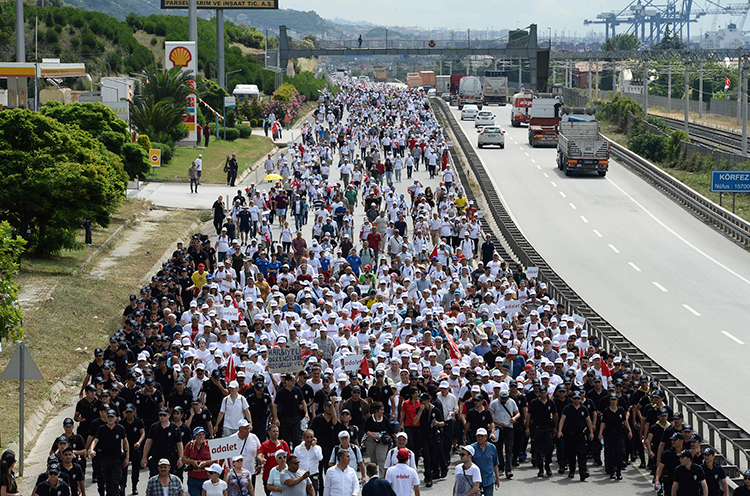 Thousands of opposition supporters pass through Izmit, Turkey, on the 21st day of a 425-kilometer (265-mile) "march for justice" to protest the jailing of opposition member of parliament and former editor Enis Berberoğlu.