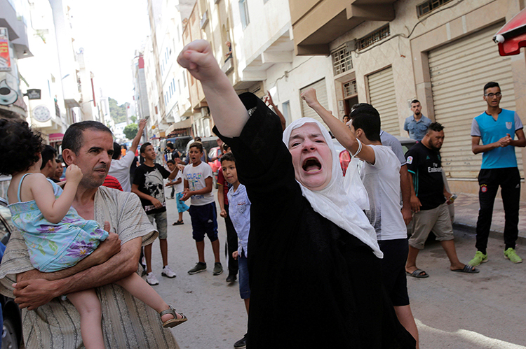 A woman shouts slogans in a protest in the Moroccan town of Al-Hoceima, July 21, 2017. (Reuters/Youssef Boudlal)