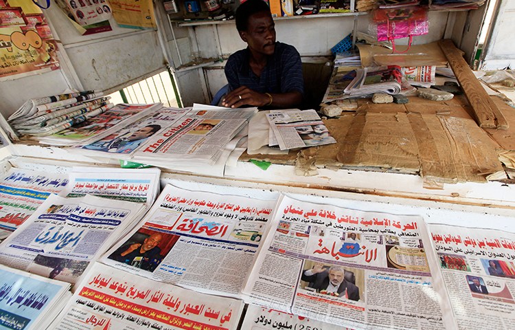 A November 13, 2015, file photo shows newspapers on display at a newsstand in Khartoum. (Reuters/Mohamed Noureldin Abdallah)