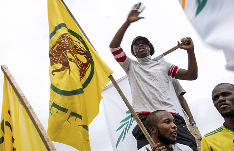 Protesters call for elections to be held at a rally in April 2016. Congolese authorities imprisoned a journalist who covered more recent demonstrations in Lubumbashi demanding that the president call elections. (AFP/Junior Kannah)