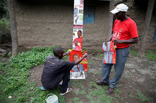 Campaign posters for local candidates are attached to pole in Nakuru. Several journalists say they have been threatened or attacked while covering the run up to Kenya's August 8 elections. (Reuters/Baz Ratner)