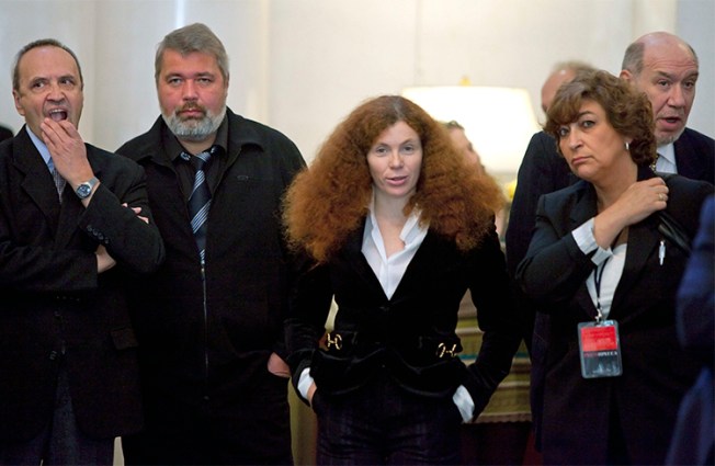 Russian journalist Yulia Latynina, pictured center in 2009 with other Novaya Gazeta journalists, is in hiding after a series of attacks on her home. (AP/Alexander Zemlianichenko)