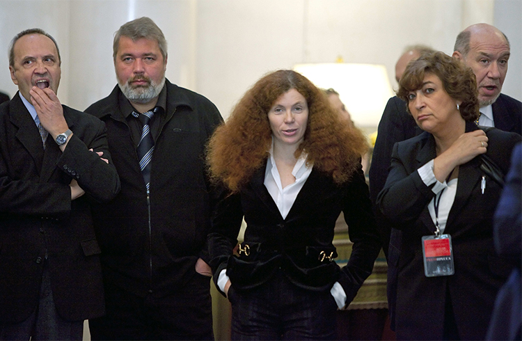 Russian journalist Yulia Latynina, pictured center in 2009 with other Novaya Gazeta journalists, is in hiding after a series of attacks on her home. (AP/Alexander Zemlianichenko)