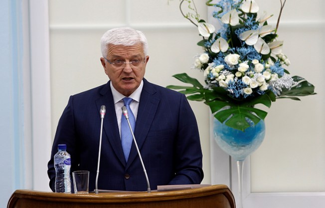 Montenegro's Prime Minister Dusko Markovic addresses the parliament during a discussion on NATO membership agreement in Cetinje, Montenegro on April 28. During a telephone conversation on Monday, a man believed to be Markovic's brother threatened a local reporter. (Reuters/Stevo Vasiljevic)