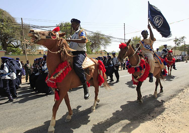 Somaliland police ride horses during independence celebrations in Hargeisa in 2013. Authorities in the region are detaining a journalist on false news accusations. (Reuters/Feisal Omar)