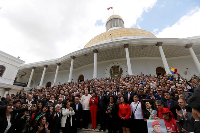 Venezuela's constituent assembly poses for an official photo after being sworn in, at the National Assembly in Caracas, Venezuela on August 4, 2017. The assembly passed a wide-reaching law on November 8 that clamps down on social media and broadcasters alike. (AP/Ariana Cubillos)