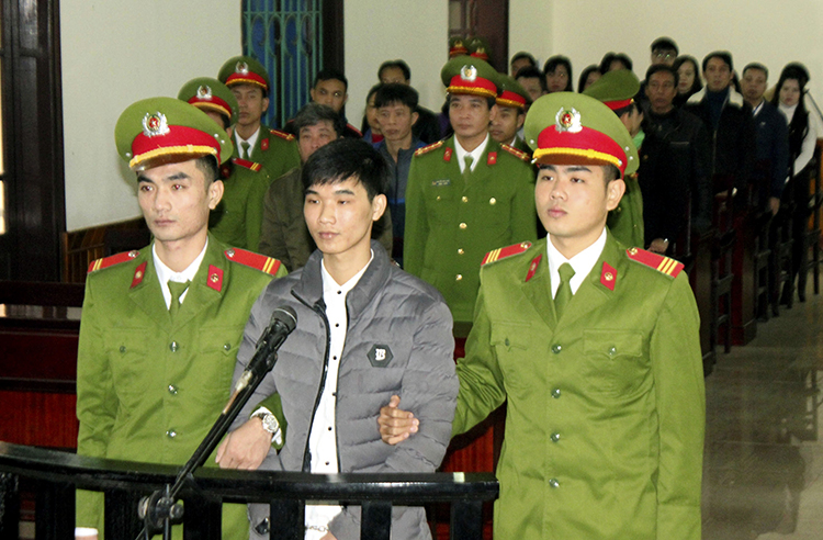 Nguyen Van Hoa, center, was sentenced to seven years in prison on November 27, 2017, after being convicted of spreading anti-state propaganda. (Cong Tuong/Vietnam News Agency/AP)