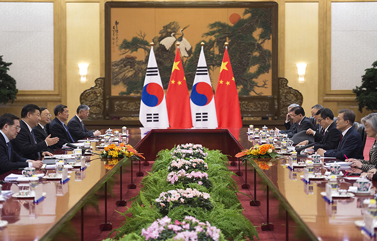 South Korean President Moon Jae-in, second right, and Chinese President Xi Jinping, second left, meet during a bilateral meeting at the Great Hall of the People in Beijing, Thursday, Dec. 14, 2017. (Nicolas Asfouri/Pool/AP)