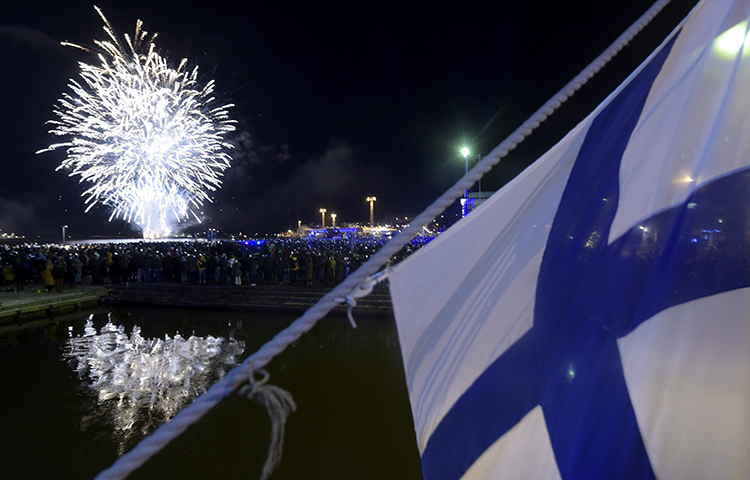 Fireworks illuminate the sky to end the festivities of the centenary of Finnish independence in Helsinki, Finland on December 6, 2017. Finnish police searched the Helsinki home of journalist Laura Halminen on December 17, 2017. (Lehtikuva/ Vesa Moilanen/ Reuters)