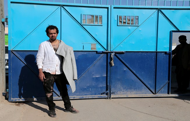 Pakistani journalist Taha Siddiqui, who escaped a kidnapping attempt, waits to be taken to the hospital after he made a statement to police in Rawalpindi, Pakistan January 10, 2018. (Reuters/Caren Firouz)