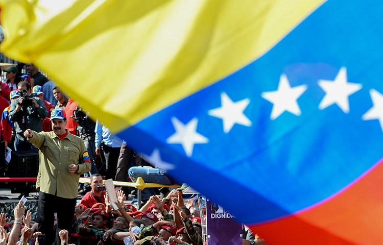 President Nicolás Maduro greets supporters at a February 2018 rally in Caracas. Venezuela's journalists say they fear a new anti-hate law will be a new tool for the government to suppress critical reporting. (AFP/Frederico Parr)