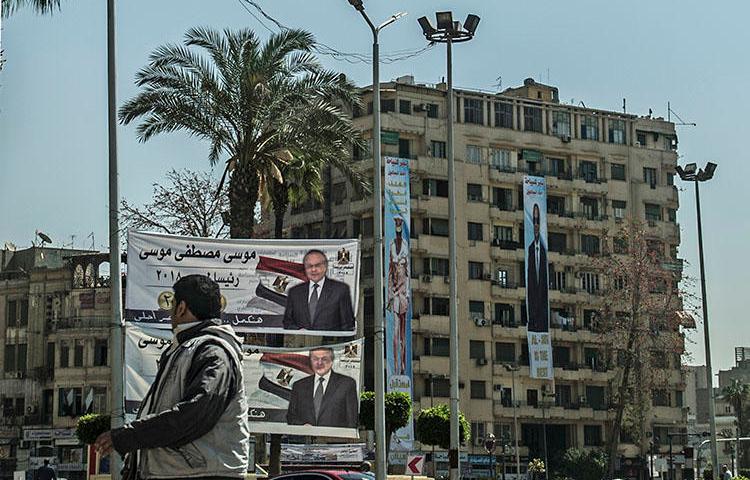 Presidential election campaign banners in downtown Cairo on March 7, 2018. At least four journalists have been detained since President Abdel Fattah el-Sisi declared his re-election bid. (AFP/Khaled Desouki)