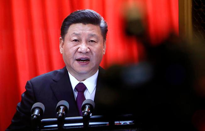 A TV screen shows Chinese President Xi Jinping delivering a speech at the closing session of the annual National People's Congress in Beijing on March 20. China's censors last month removed from social media any words suggesting Xi is seeking a life term. (AP/Andy Wong)