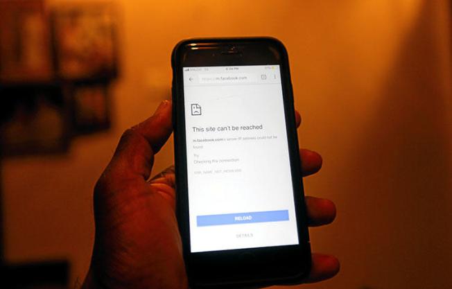 A mobile phone screen shows that Facebook will not open following a government decision on March 7, 2018, to shut down social messaging networks across the island for 72 hours. (Reuters/Dinuka Liyanawatte)