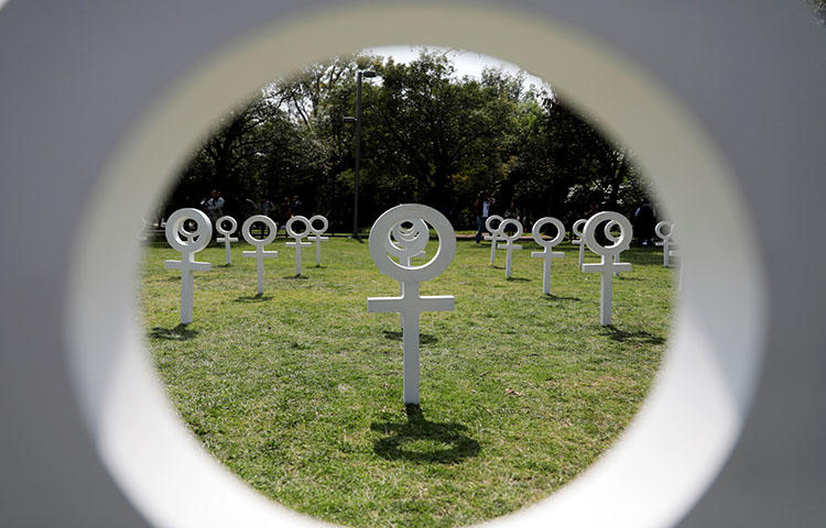 Venus symbols are seen during an event where UN Women and rights groups launched a campaign against violence towards women as International Women's Day approaches, in Mexico City, Mexico in March 2018. CPJ has documented threats faced by women journalists across the globe. (Reuters/Henry Romero)