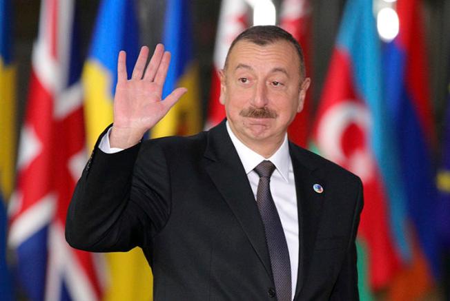 Azerbaijan's President Ilham Aliyev arrives in Brussels in November 2017. Azerbaijan has continued to harass and censor its press ahead of snap elections scheduled for April 11. (AP/Olivier Matthys/File)