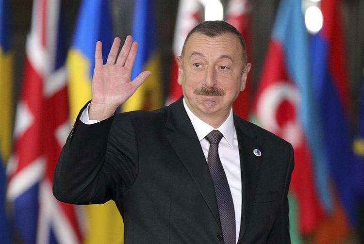 Azerbaijan's President Ilham Aliyev arrives in Brussels in November 2017. Azerbaijan has continued to harass and censor its press ahead of snap elections scheduled for April 11. (AP/Olivier Matthys/File)