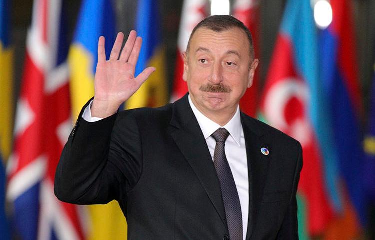 Azerbaijan's President Ilham Aliyev arrives in Brussels in November 2017. Azerbaijan has continued to harass and censor its press ahead of snap elections scheduled for April 11. (AP/Olivier Matthys/File)