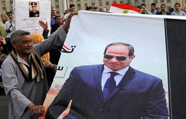 Supporters of Egyptian President Abdel Fattah el-Sisi in Tahrir square after presidential election results in Cairo, Egypt on April 2, 2018. Egyptian authorities stepped up censorship during last month's presidential campaign, arresting journalists on