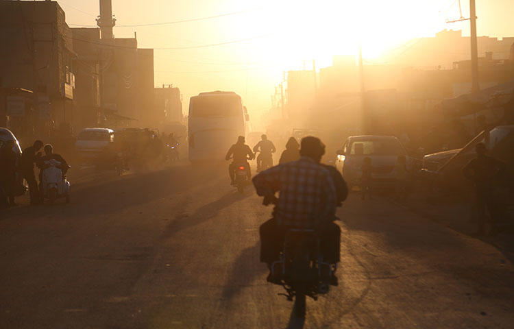 Buses arrive in the Syrian town of Azaz on April 5, 2018. A correspondent and cameraperson from Syria TV were detained and assaulted by Members of the General Public Security, a Free Syrian Army (FSA) security force on May 15, 2018, according to reports. (AFP/Nazeer al-Khatib)