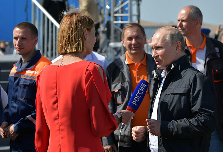 Russian President Vladimir Putin gives an interview at a May 15, 2018, ceremony opening a bridge that will connect the Russian mainland with the Crimean Peninsula. Ukraine authorities accused the director of Russian state news agency RIA Novosti's Kiev office of propaganda supporting the annexing of Crimea. (Sputnik/Alexei Druzhinin/Kremlin via Reuters)