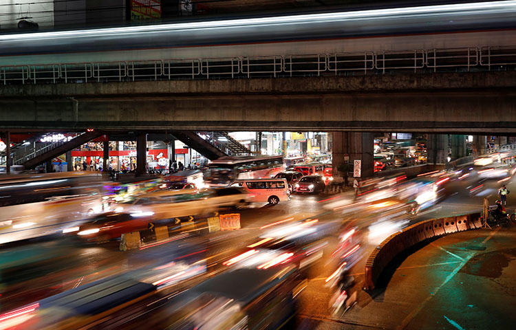 A main thoroughfare during rush hour in Quezon City, Philippines in February 2018. A Filipino journalist died on May 2, 2018, from injuries sustained in a shooting attack on April 30 in Dumaguete City. (Reuters/Dondi Tawatao)