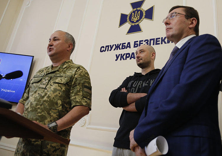 Vasily Gritsak, head of the Ukrainian Security Service, left, speaks to the media as Russian journalist Arkady Babchenko, center, and Ukrainian Prosecutor General Yuriy Lutsenko attend a news conference at the Ukrainian Security Service on May 30, 2018. Babchenko turned up at a news conference in the Ukrainian capital Wednesday less than 24 hours after police reported he had been shot and killed in Kiev. (AP/Efrem Lukatsky)