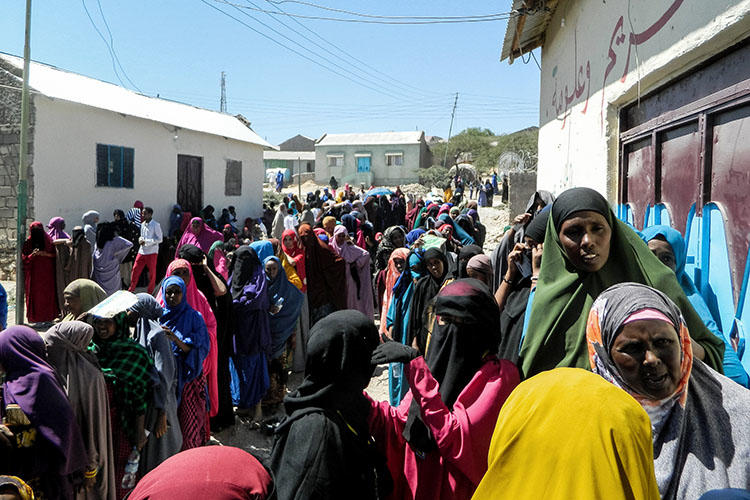 People wait in a line to cast their votes in the presidential election at a polling station in Hargeisa, Somaliland, on November 13, 2017. Somaliland authorities in late May 2018 detained two journalists and banned two TV stations. (AFP)