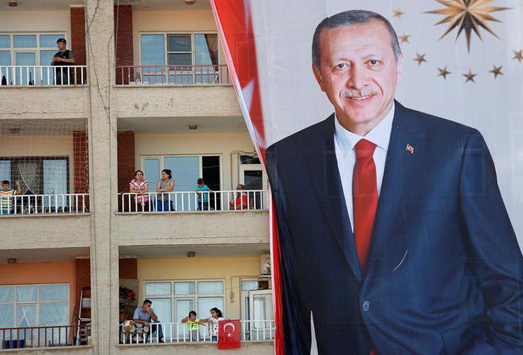 People watch an election rally for President Erdoğan in Mardin, on June 20. An OSCE report released ahead of Turkey's elections highlights the restrictive environment for the press. (Reuters/Goran Tomasevic)