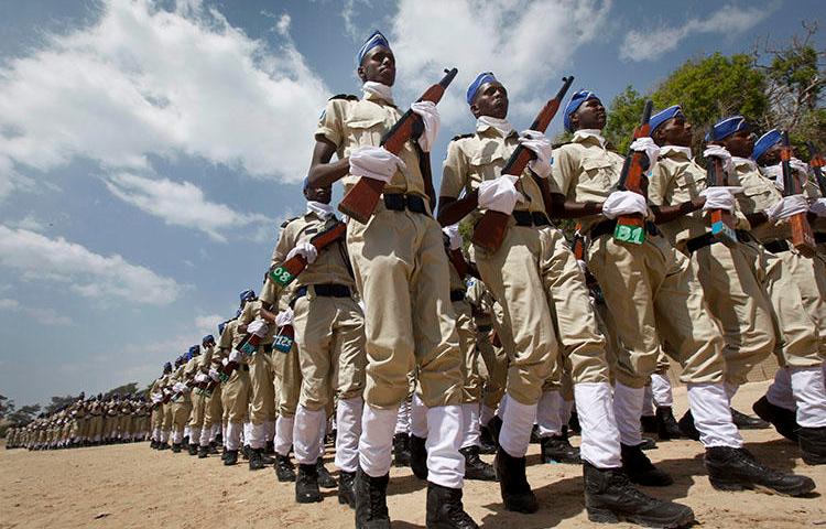 Somali police at a ceremony in Mogadishu on December 20, 2017, to mark the 74th anniversary of the formation of the police force. Abdirizak Kasim Iman, a cameraperson for the privately owned SBS TV, was shot dead in Mogadishu on the afternoon of July 26, 2018, according to news reports. (AP/Farah Abdi Warsameh)