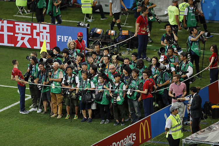 Press photographers at a 2018 World Cup match in Rostov-on-Don, Russia, on July 2. At least four female sports journalists were grabbed or sexually harassed while covering the soccer tournament. (AP/Hassan Ammar)