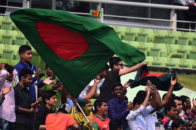 The Bangladesh flag is waved during a cricket match in Dhaka in early 2018. At least four journalists were attacked in Bangladesh while covering local elections in July. (AFP/Munir Uz Zaman)