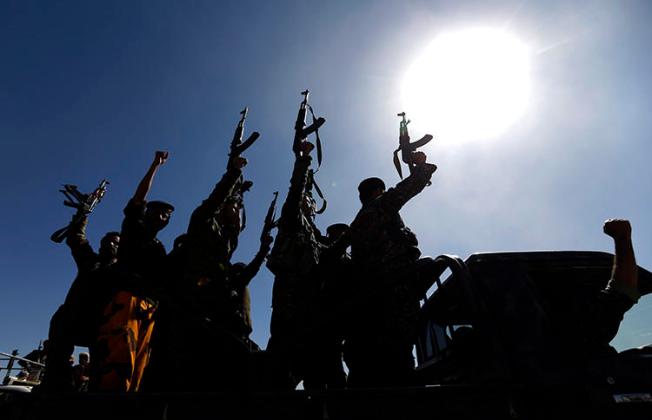 Houthis chant slogans in Sanaa in January 2017. A Yemeni journalist has been detained since July 22 after being stopped at a Houthi checkpoint in Rahda. (AFP/Mohammed Huwais)