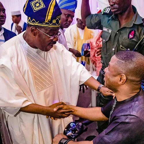 Nigerian musician and Fresh FM owner Yinka Ayefele (right) and Abiola Ajimobi, governor of Oyo state (left), greet each other on August 26, 2018, at an event for the 90th birthday of Oba Saliu Adetunji, The Olubadan (Lord of Ibadan). (Tolani Alli)