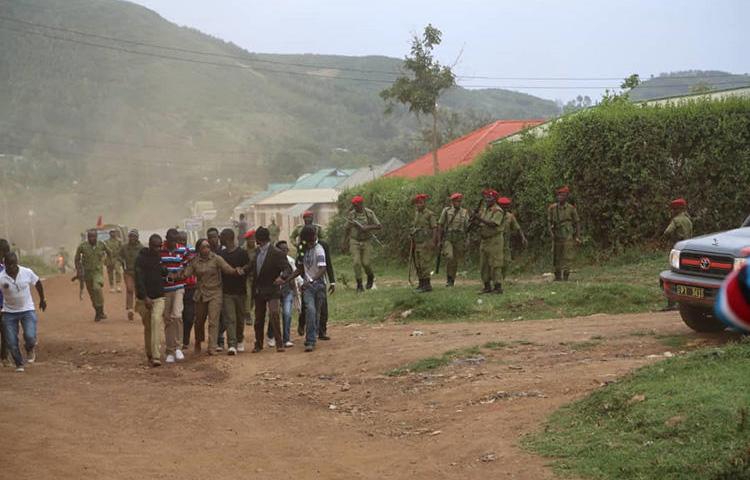 Opposition politician Esther Matiko (center) and her supporters, with police in the background, before being arrested at a campaign rally on August 8, 2018, in Tarime District, northern Tanzania. (Sitta Tumma)