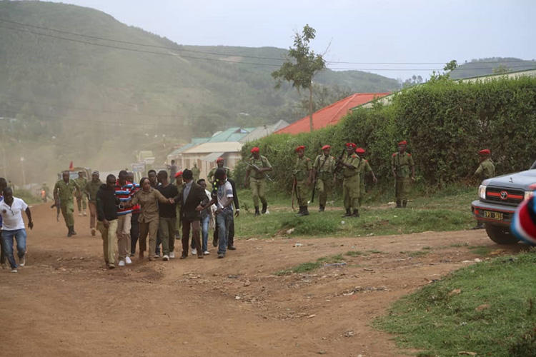 Opposition politician Esther Matiko (center) and her supporters, with police in the background, before being arrested at a campaign rally on August 8, 2018, in Tarime District, northern Tanzania. (Sitta Tumma)