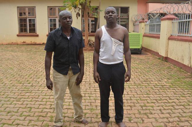 Journalists Herbert Zziwa, right, and Ronald Muwanga are pictured shortly after being released from Gulu Central Police station. (Daily Monitor/Julius Ocungi)