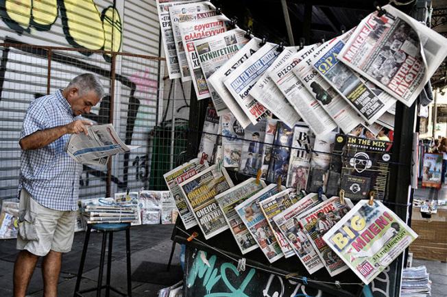 A newspaper stand in Athens, in July 2017. Police detained three journalists at the daily paper Fileleftheros, after a politician filed a defamation complaint. (AFP/Louisa Gouliamaki)