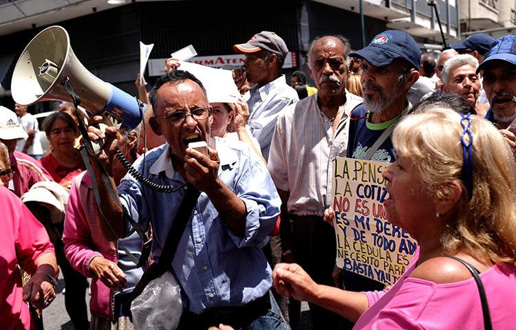 People attend a retirees protest in Caracas, Venezuela, on August 29, 2018. A Venezuelan freelance photographer was detained and sent to a military prison in late August. (Reuters/Marco Bello)