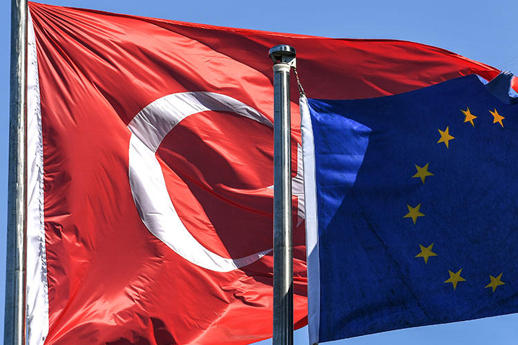 Turkish and European Union flags pictured in Istanbul's financial and business district in August. Turkey continues its crackdown on press freedom, with more journalists detained and questioned over their reporting this week. (AFP/Ozan Kose)