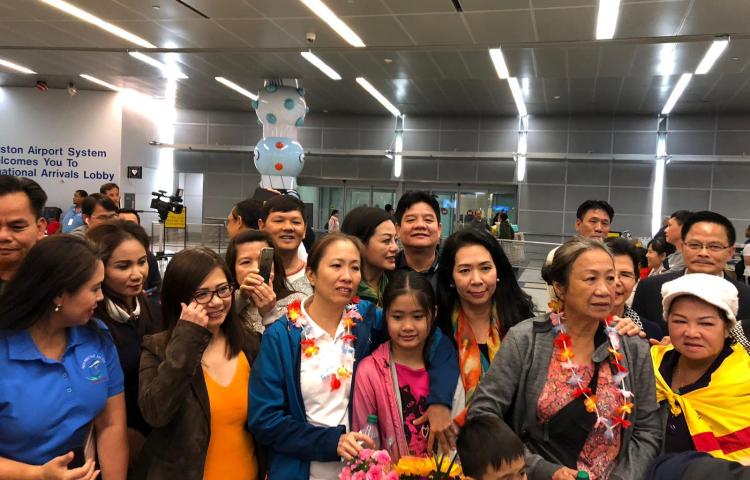 Vietnamese blogger Nguyen Ngoc Nhu Quynh, known by her pen name "Mother Mushroom," (center, in white) with a group of supporters upon her arrival at the airport in Houston, Texas, on Thursday. (Danlambao News)