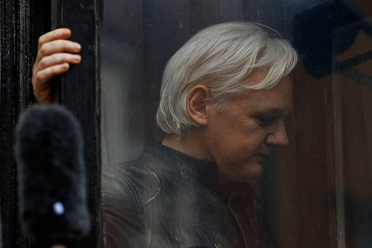 WikiLeaks founder Julian Assange is seen on the balcony of the Ecuadoran Embassy in London, U.K., on May 19, 2017. (Reuters/Peter Nicholls)