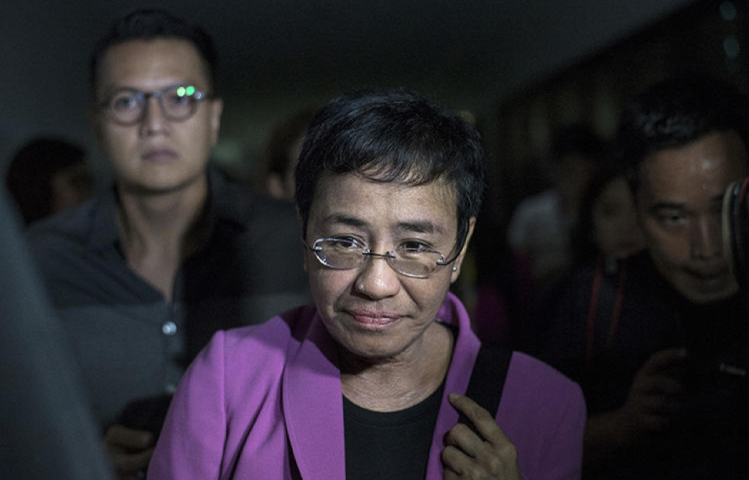 Maria Ressa, the founder of Rappler, arrives at the National Bureau of Investigation headquarters in Manila on January 22, 2018. Ressa says she believes the news website is being harassed because of its critical coverage of the president of the Philippines. (AFP/Noel Celis)