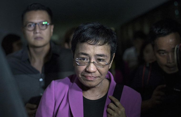 Maria Ressa, the founder of Rappler, arrives at the National Bureau of Investigation headquarters in Manila on January 22, 2018. Ressa says she believes the news website is being harassed because of its critical coverage of the president of the Philippines. (AFP/Noel Celis)