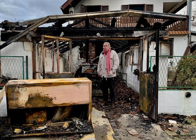 Serbian investigative journalist Milan Jovanović stands in the ruins of his home in the Belgrade suburb of Vrčin. His home was burned down in an arson attack on December 12, 2018. (Cenzolovka)