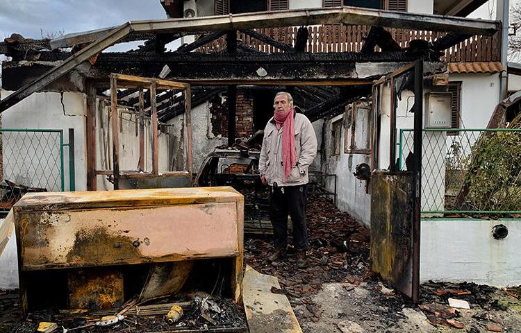 Serbian investigative journalist Milan Jovanović stands in the ruins of his home in the Belgrade suburb of Vrčin. His home was burned down in an arson attack on December 12, 2018. (Cenzolovka)