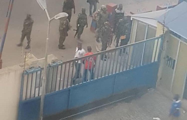 Members of the military pictured outside the Daily Trust offices in Abuja on January 6. Two of the paper's offices were raided, and one journalist is detained. (Daily Trust/Abubakar Adam Ibrahim)