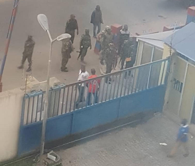 Members of the military pictured outside the Daily Trust offices in Abuja on January 6. Two of the paper's offices were raided, and one journalist is detained. (Daily Trust/Abubakar Adam Ibrahim)